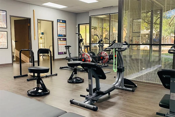 Rehabilitation area at ChiroCare Medical Center with equipment used for injury recovery.