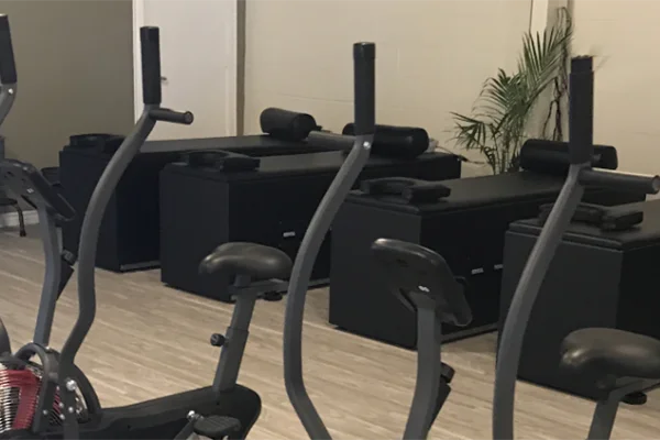 Rehabilitation area at ChiroCare West San Antonio with equipment used for injury recovery.